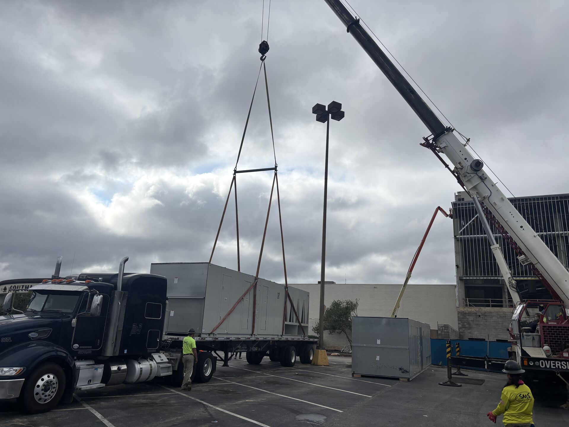 HVAC unit being placed by crane