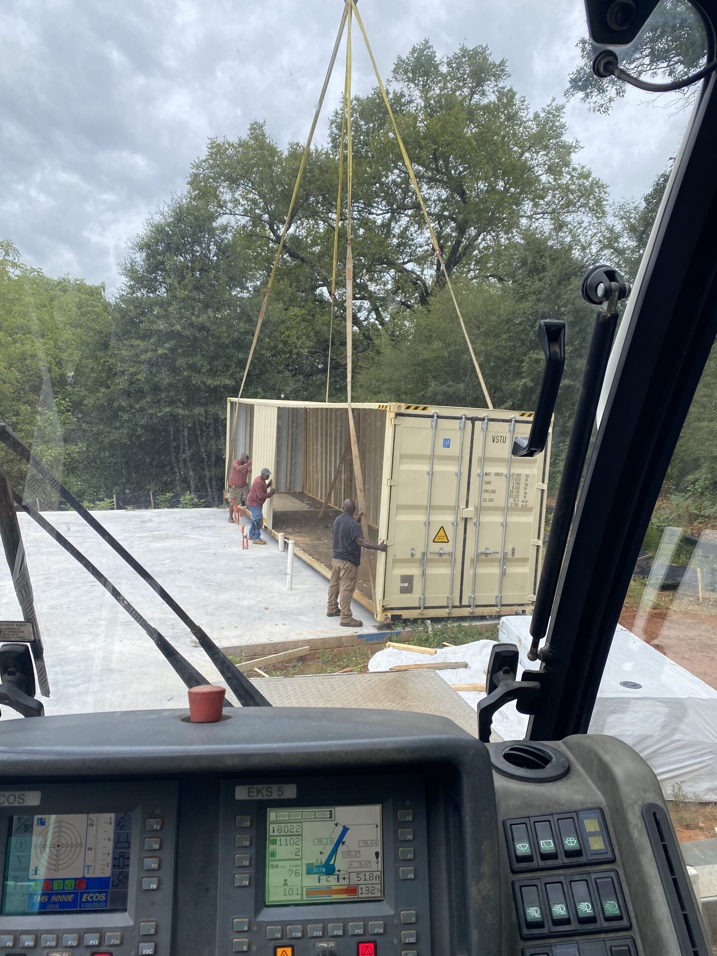 Crane working at a brick and dirt construction site