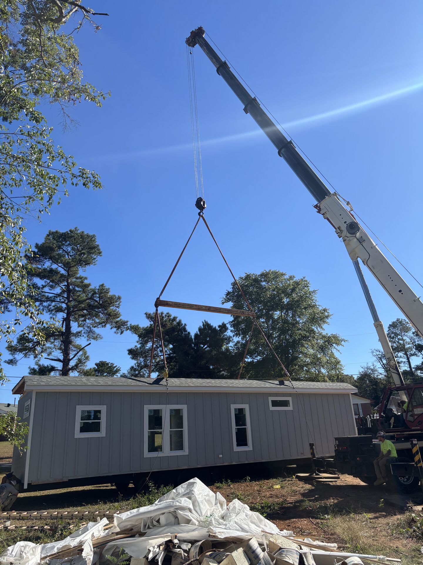 Crane lifting at a residential property
