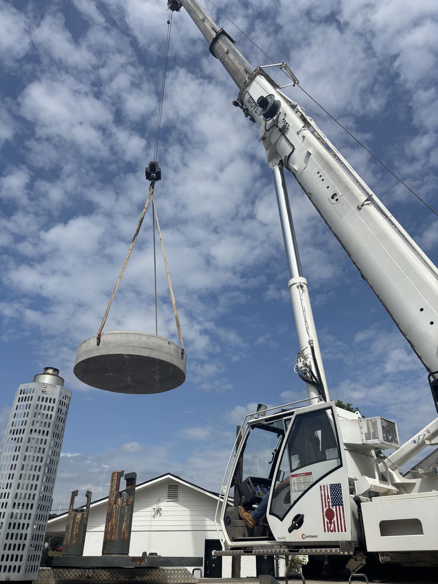 Red boom crane at a construction site