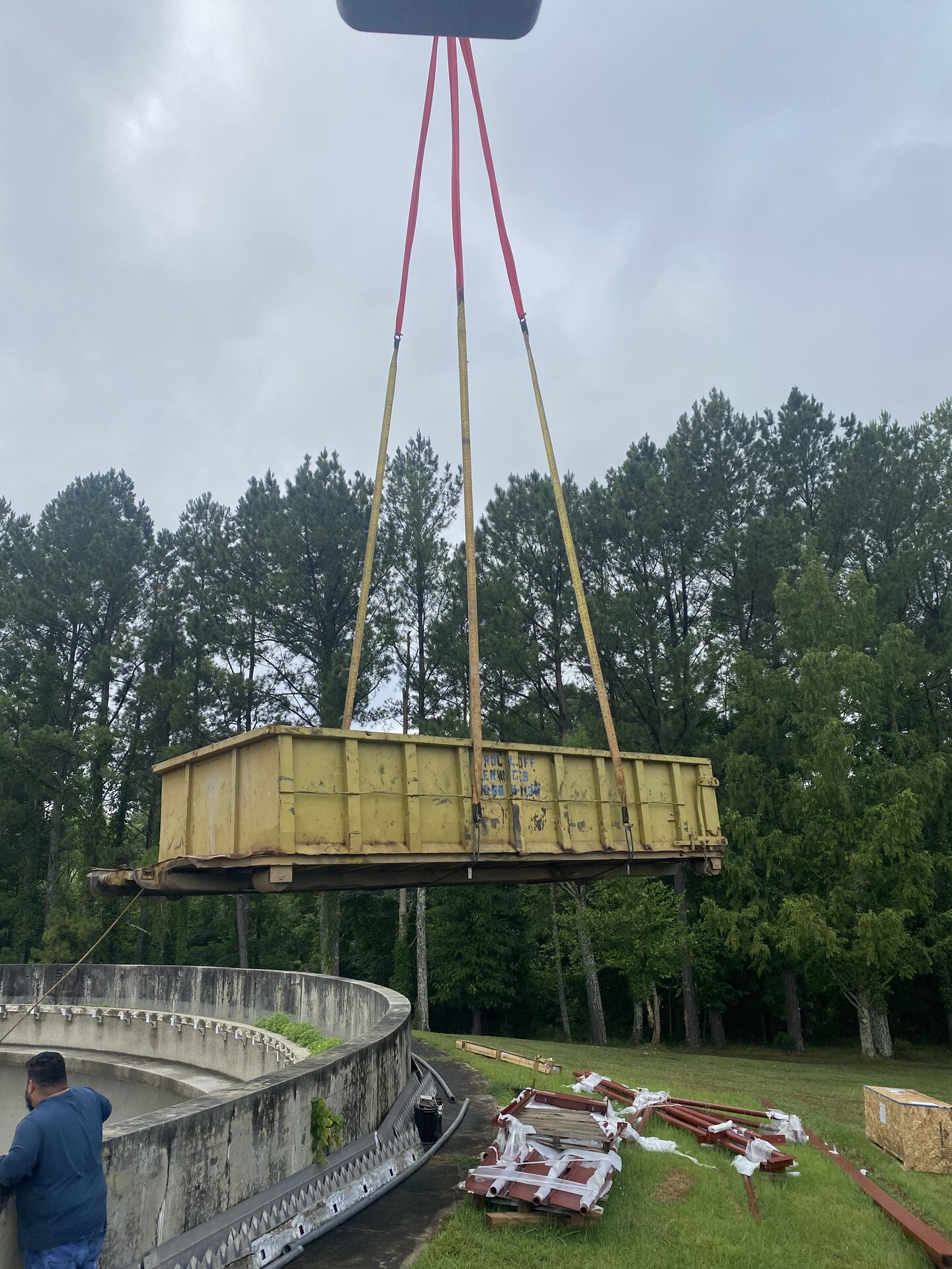 Crane lifting a shipping container during a heavy haul job