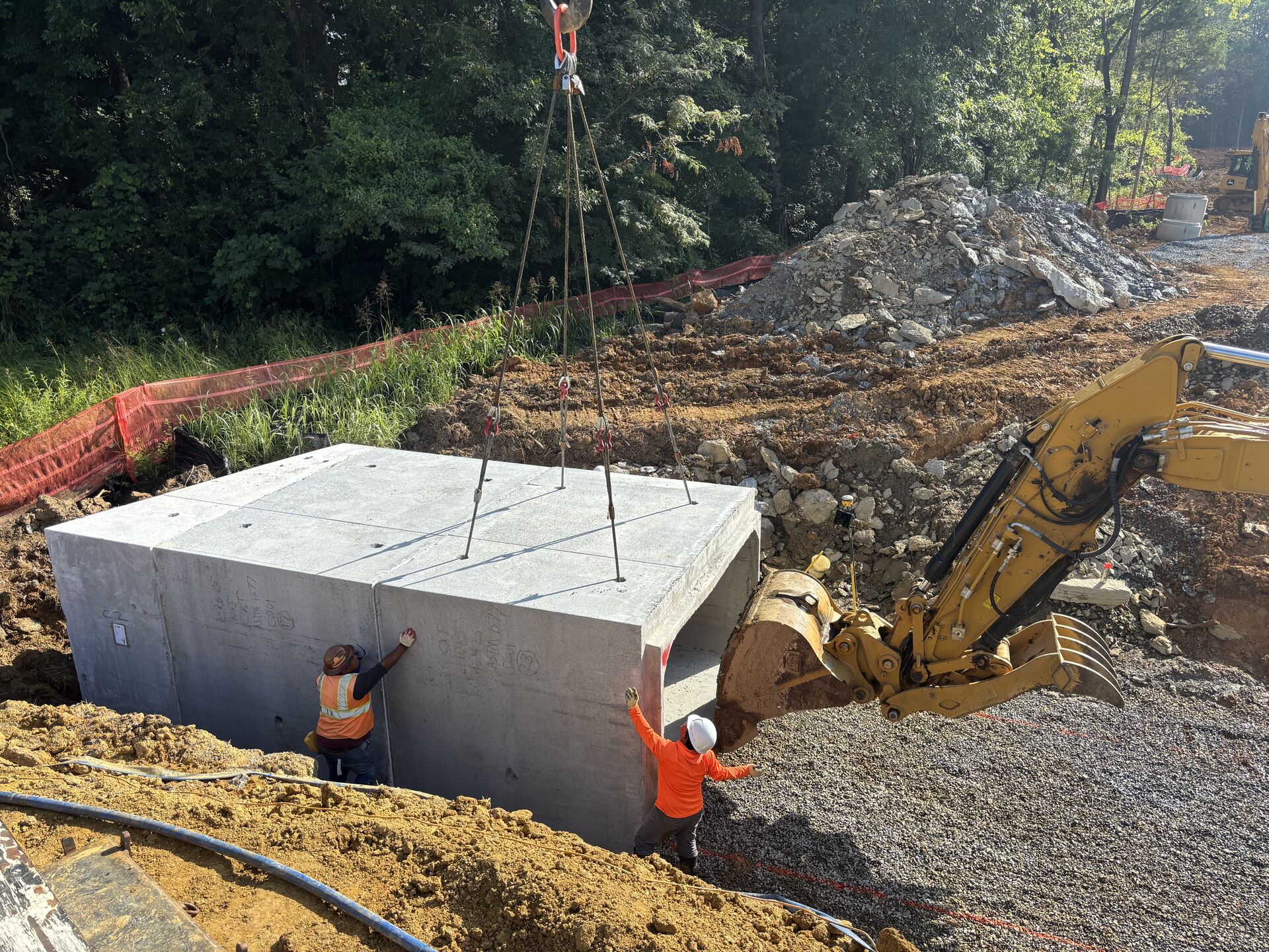 Crane positioning an industrial tank