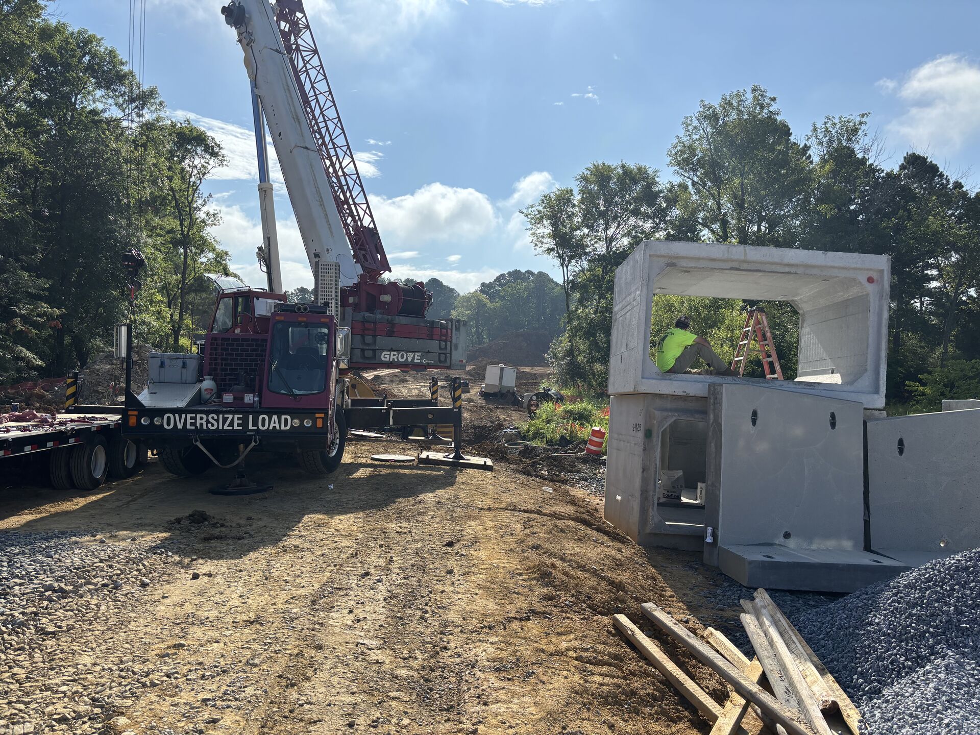 Crane delivering concrete materials at a construction site