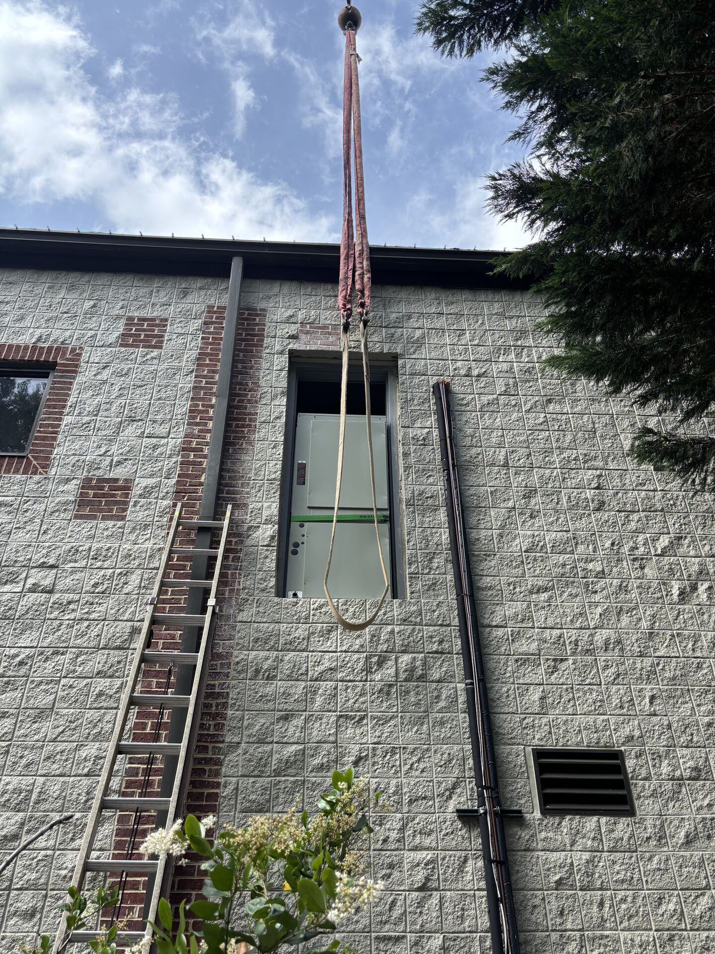 Crane working at a metal building construction site