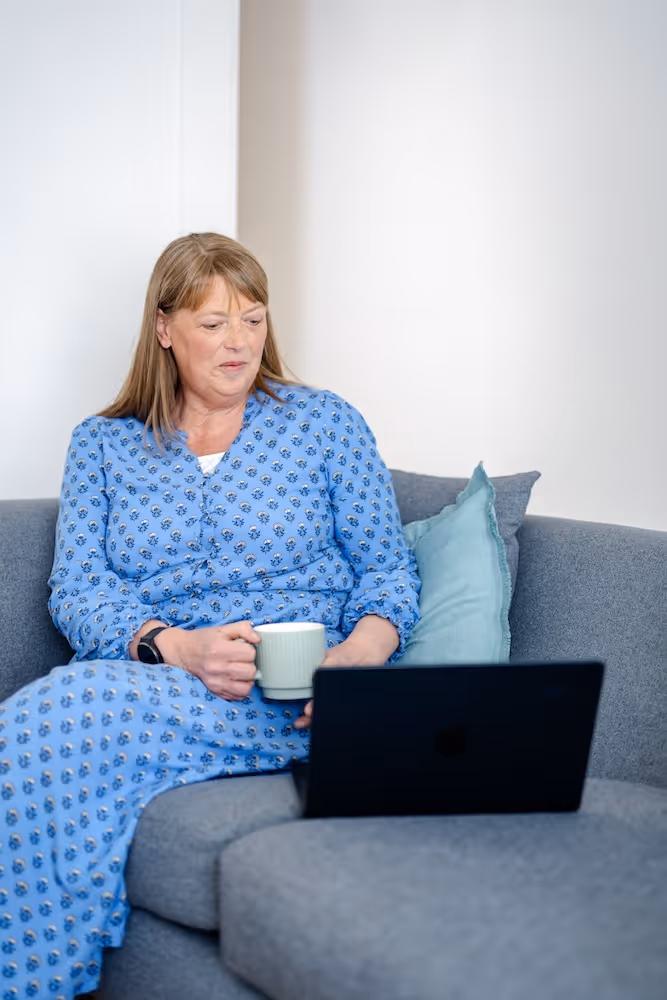 Sarah Lloyd working on a laptop