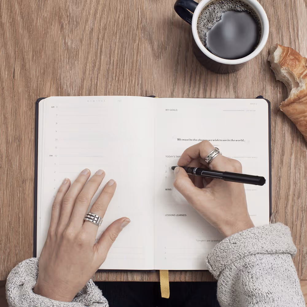 Woman writing in a book