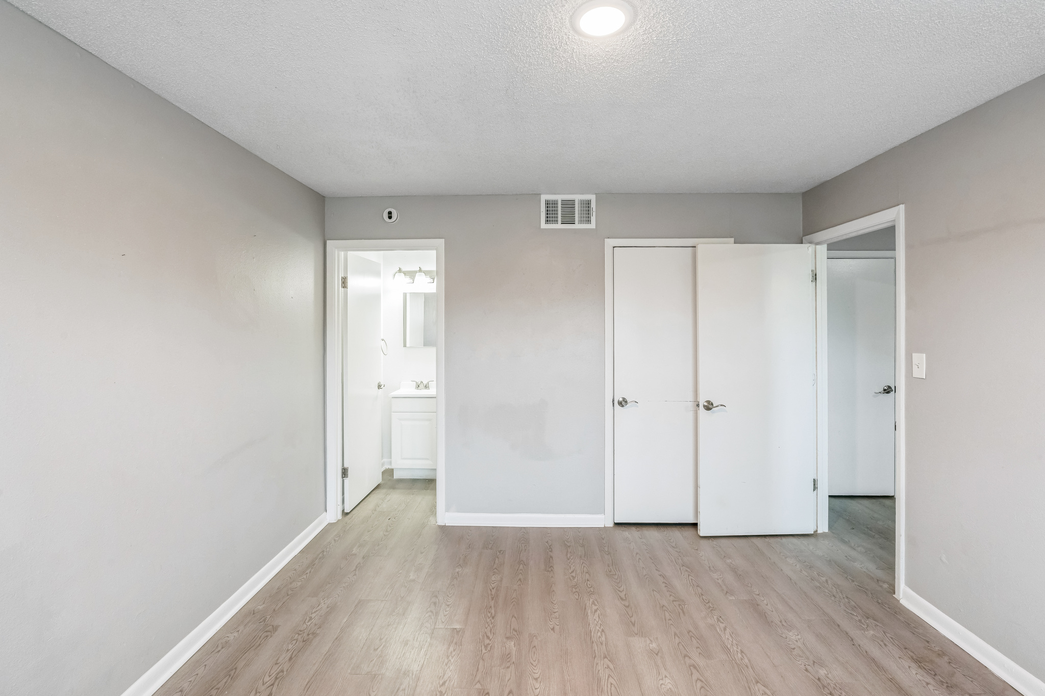 Bedroom with wood floors