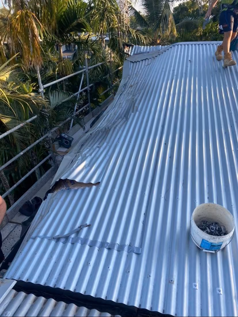 Completed high-set outdoor roof structure extending over a timber deck and living area in Darwin.