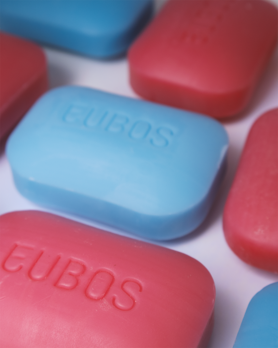 Close-up of colourful Eubos soap bars in a pastel arrangement.