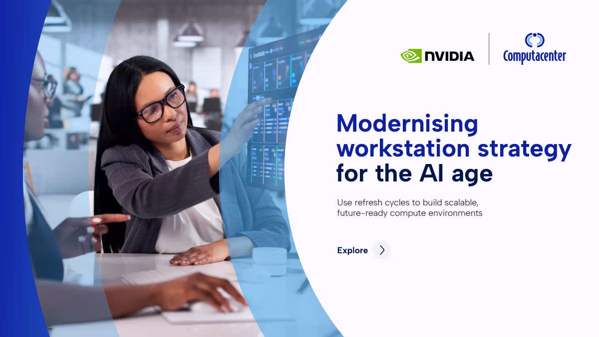 Woman pointing to data on a large screen, discussing workstation strategy for AI with colleagues.