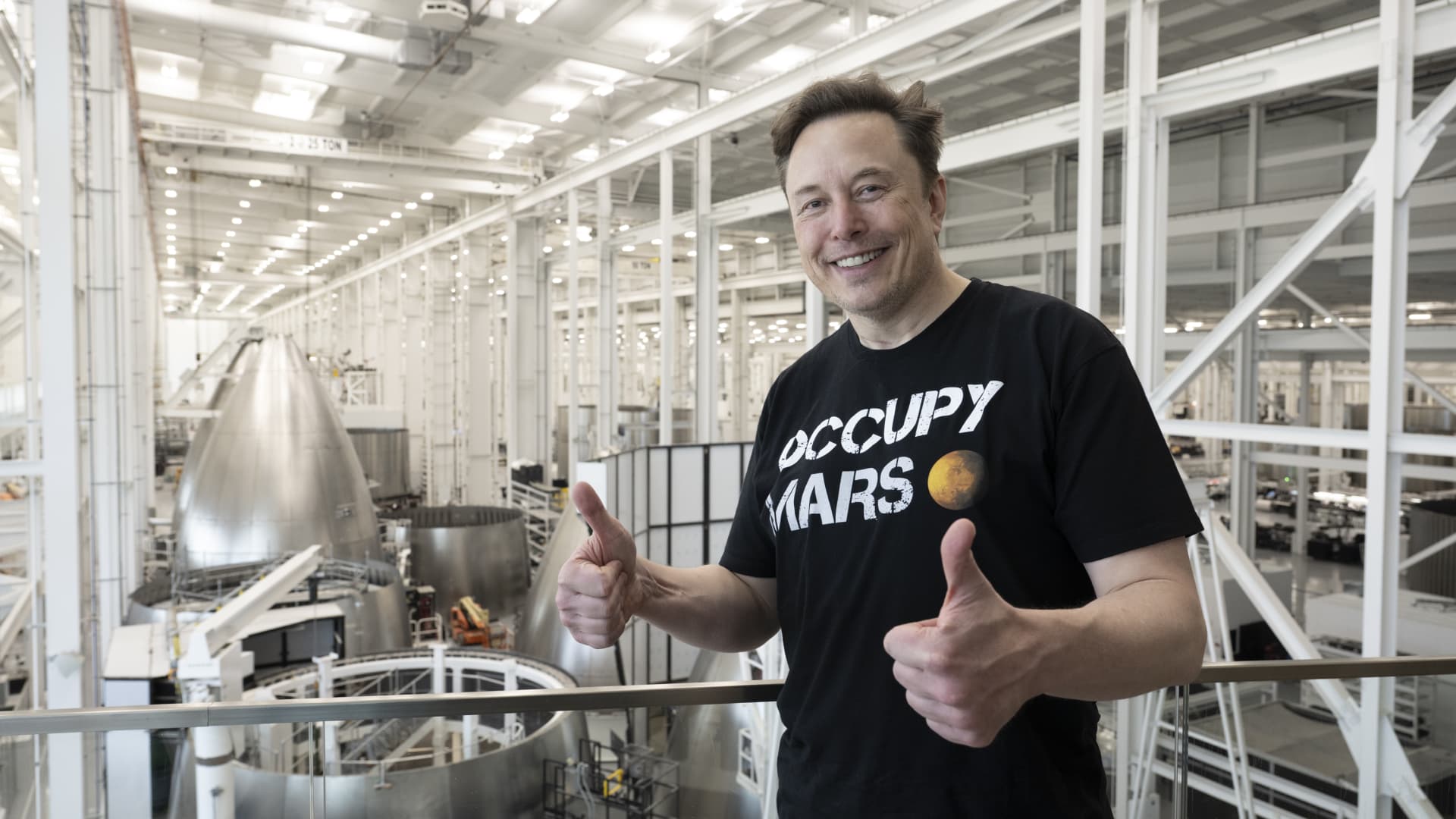 Elon Musk wearing an Occupy Mars t-shirt.