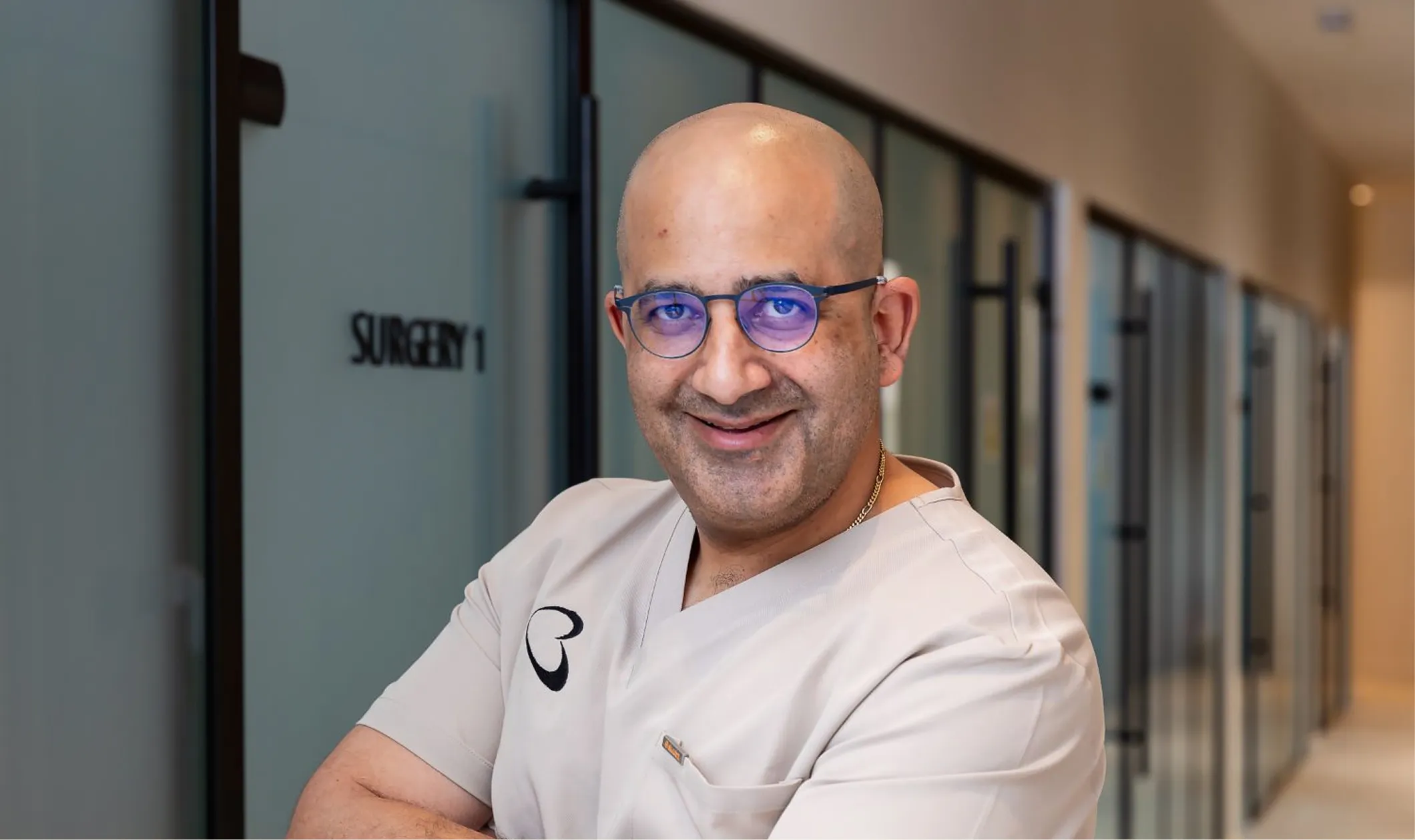 Portrait of a Bella Dental dentist standing in the practice corridor outside Surgery 1