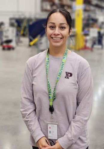 A Truvant intern standing in the warehouse