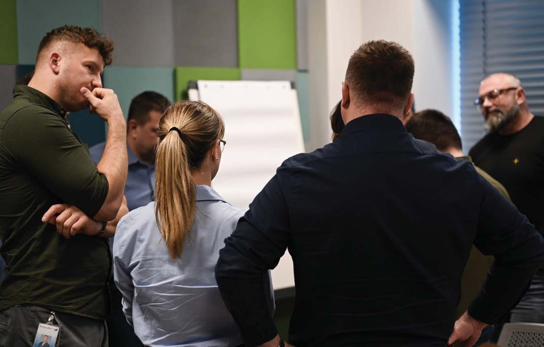 Truvant managers in discussion during a workshop