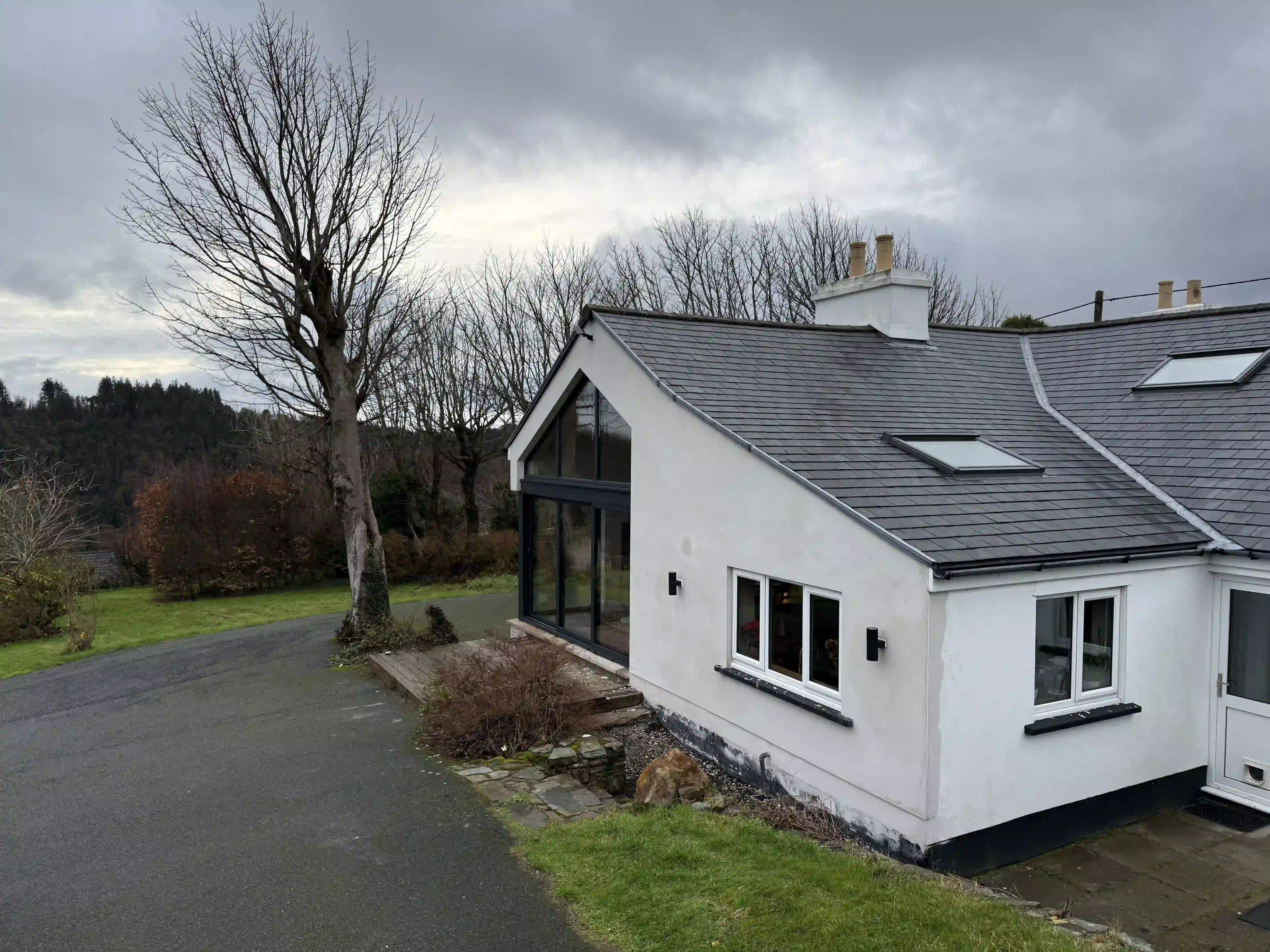 Renovated cottage with new gable glazing at Ballamillighyn Cottage, Laxey