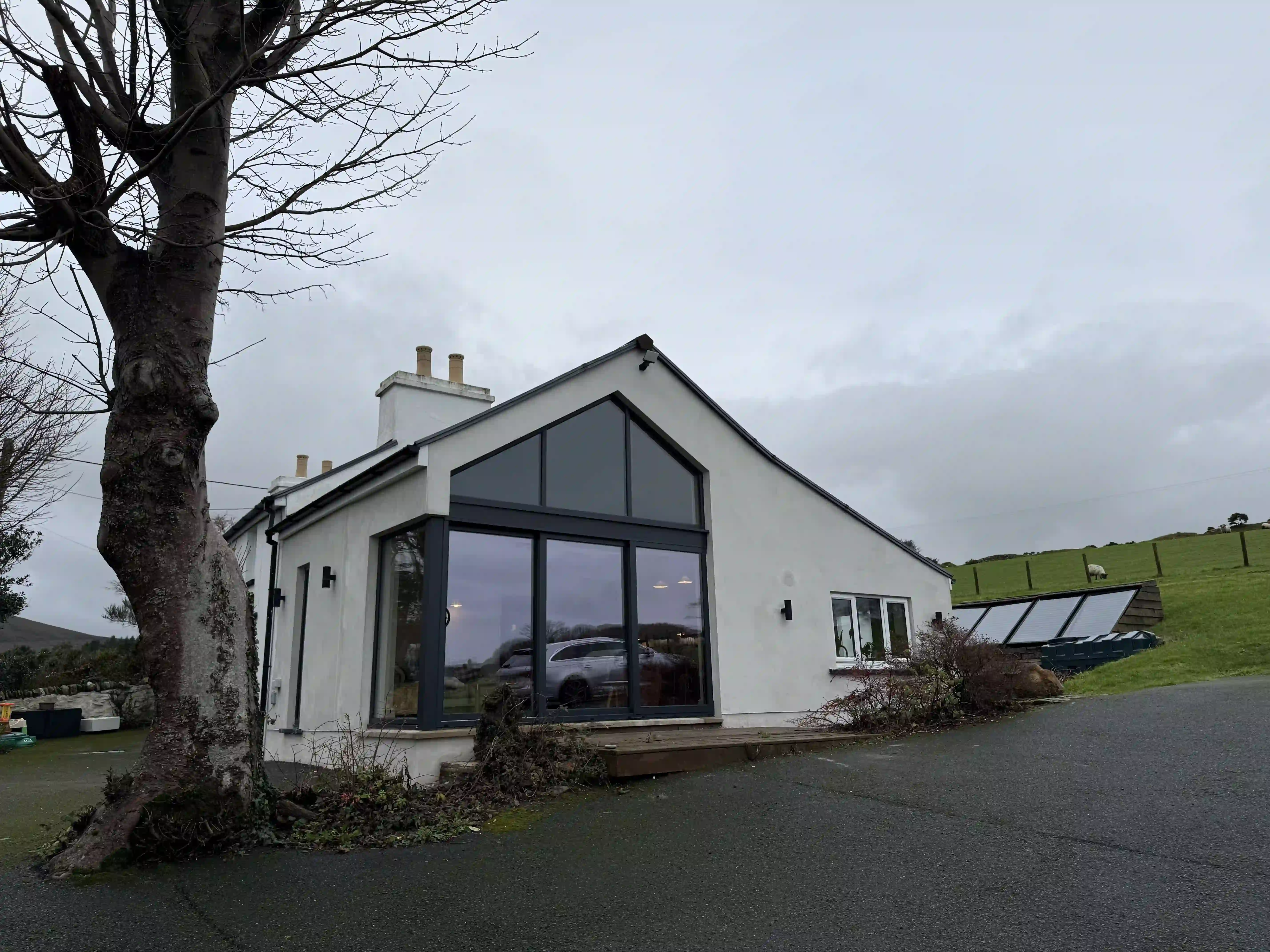 Glazed gable extension at Ballamillighyn Cottage, Laxey after renovation