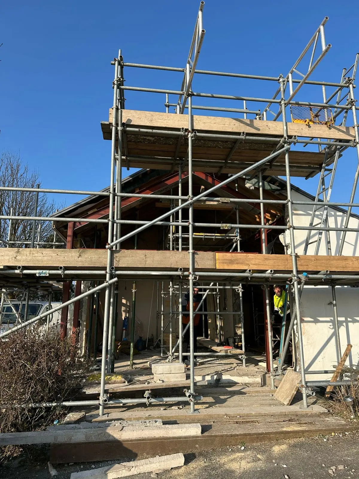 Scaffold around Ballamillighyn Cottage, Laxey during renovation