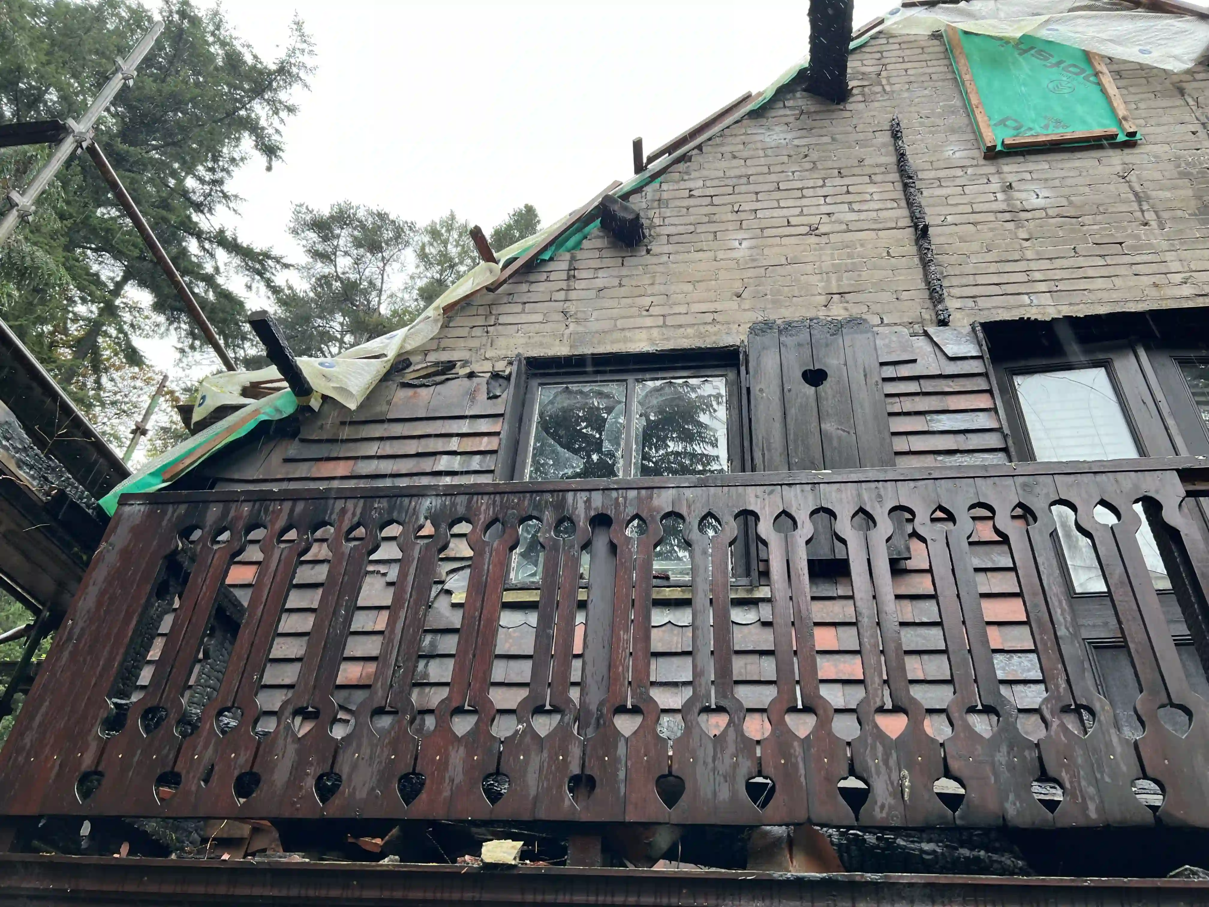 Fire-damaged gable and balcony of the Swiss Chalet at Glen Helen before restoration