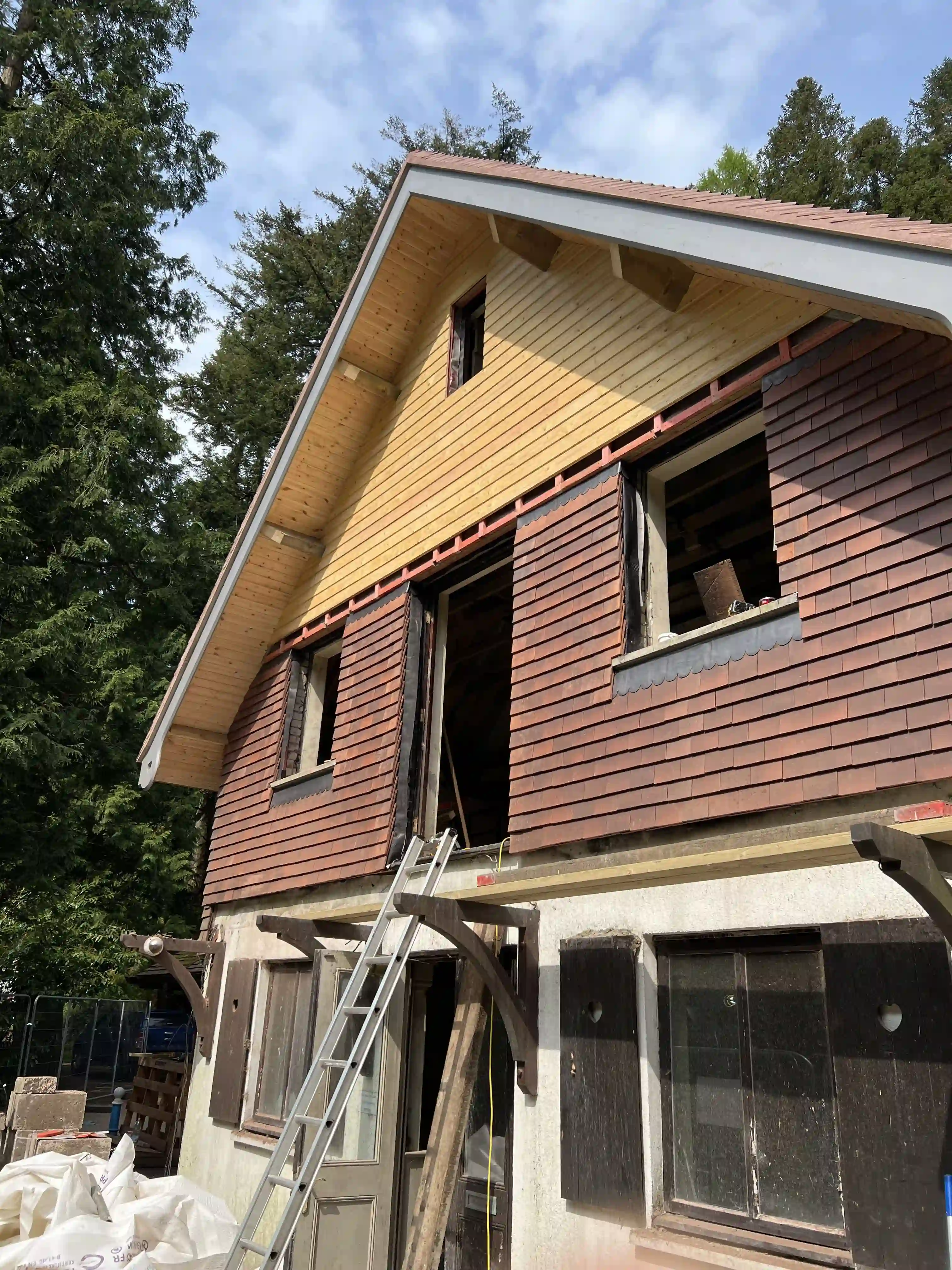 New timber cladding and dormer on the Swiss Chalet at Glen Helen during restoration
