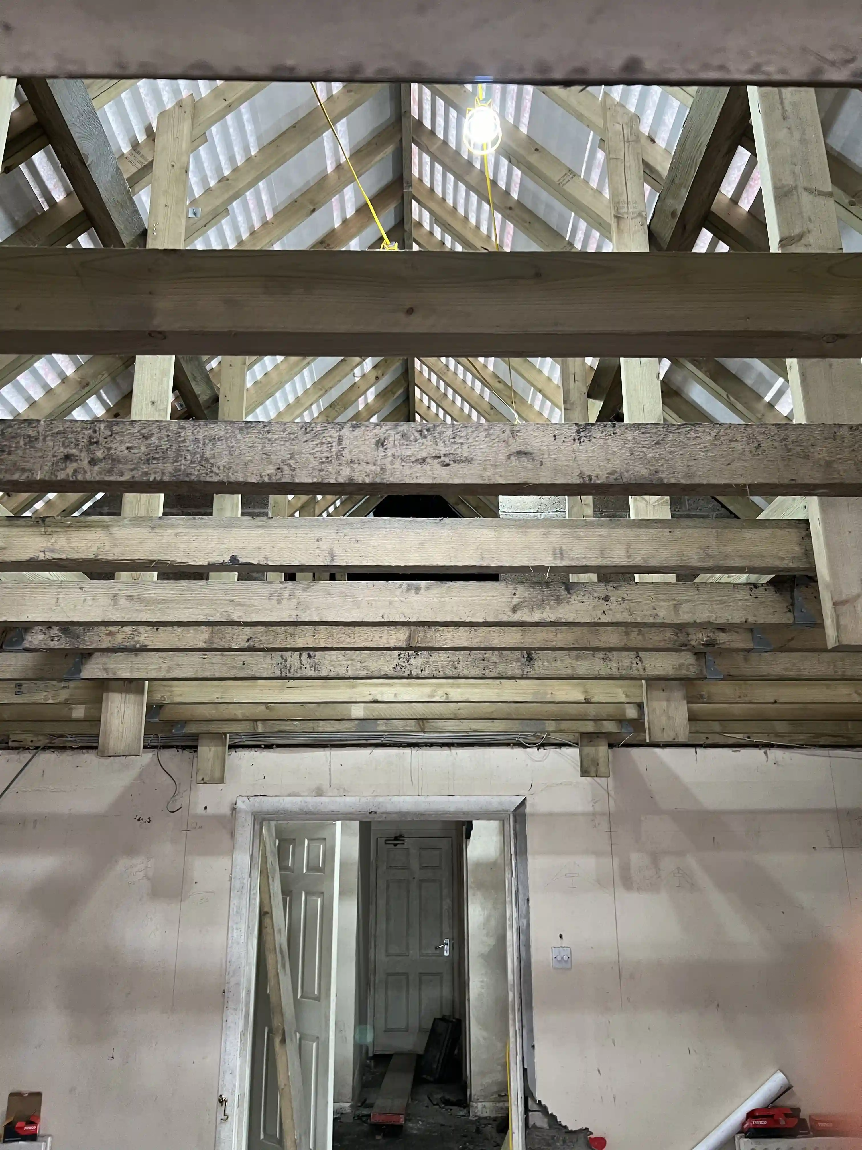 New roof timbers inside the Swiss Chalet at Glen Helen during reinstatement