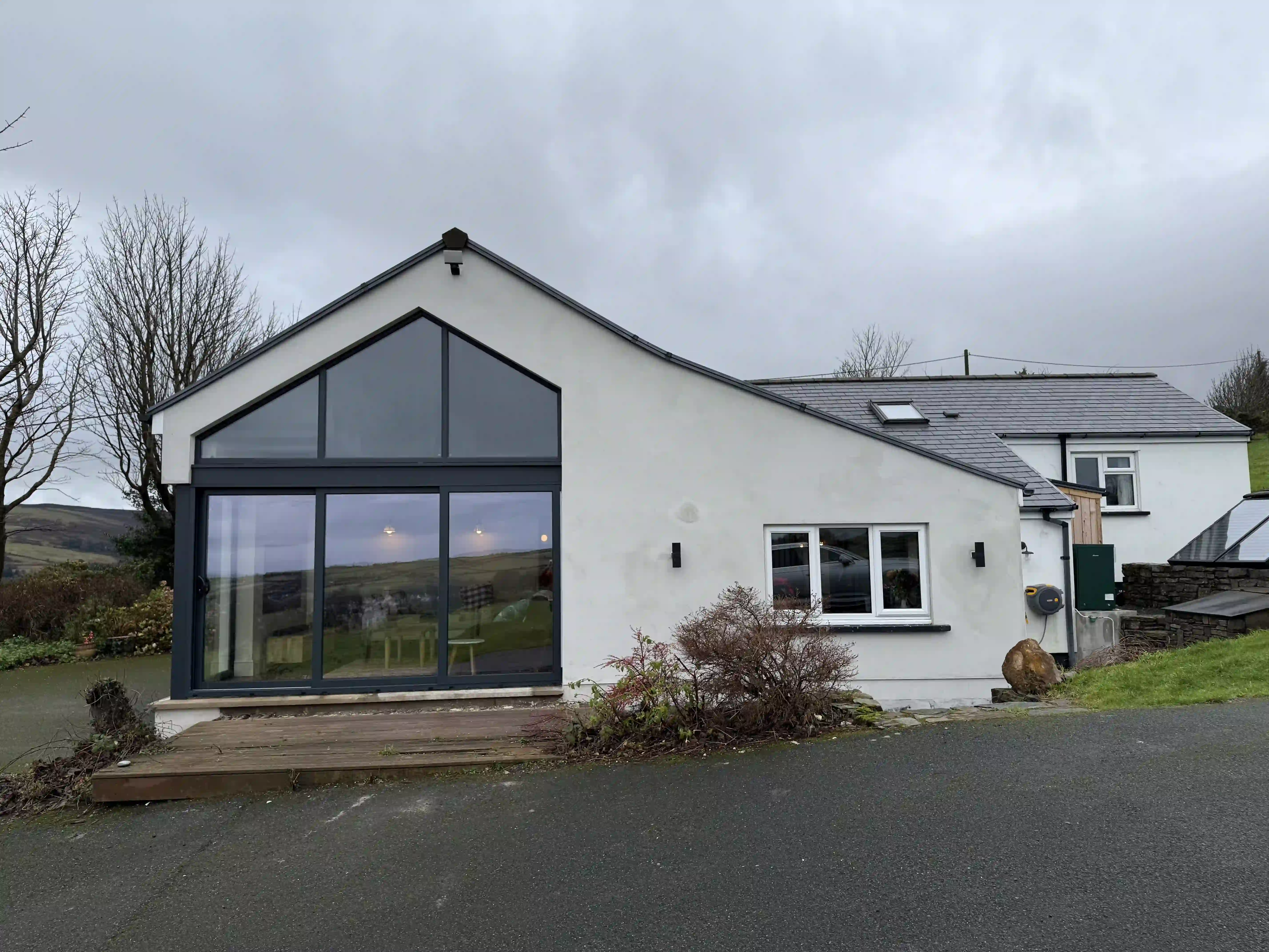 Glazed gable extension on the renovated Ballamillighyn Cottage, Laxey