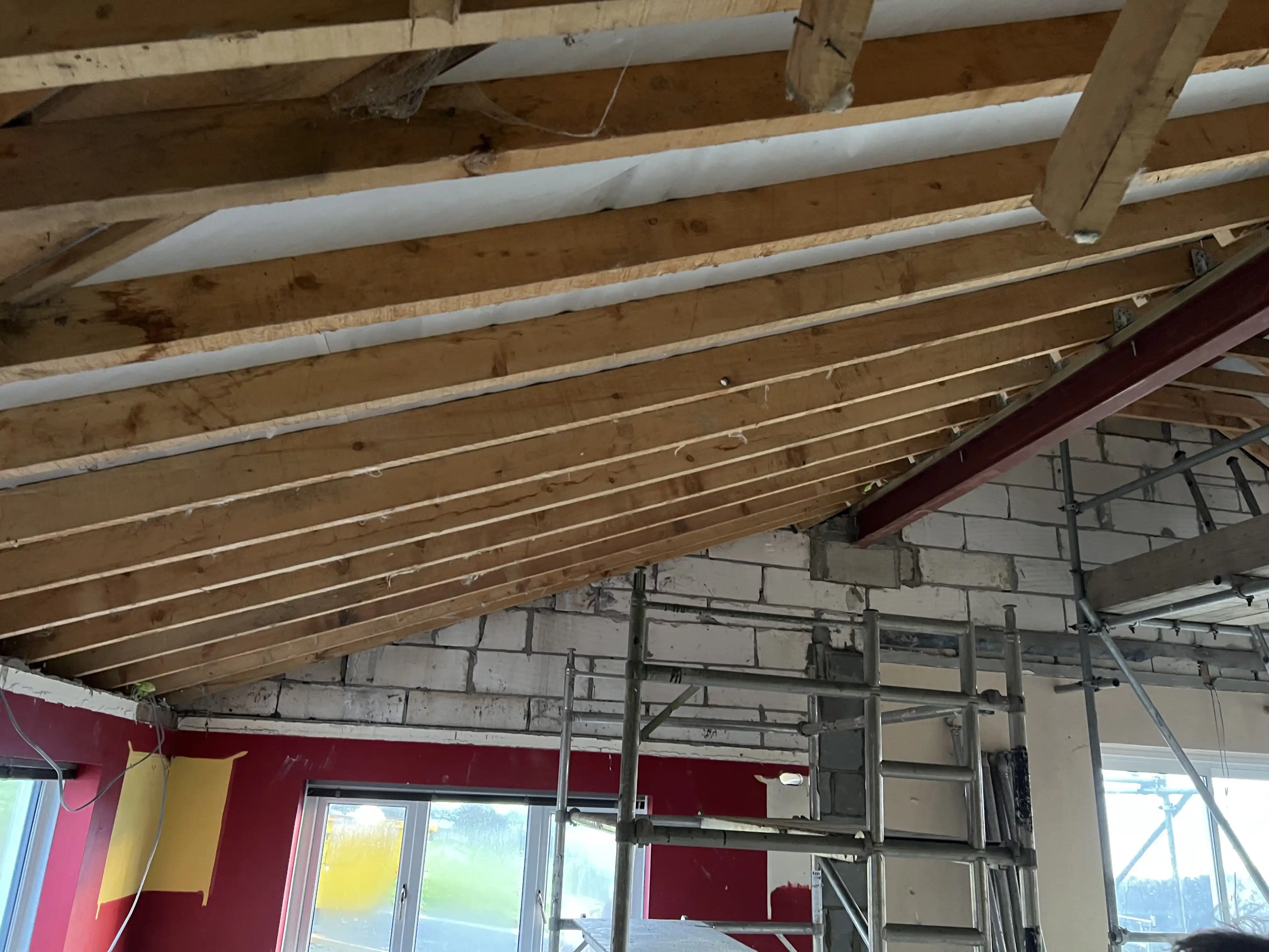 Roof structure with new steel beam during works at Ballamillighyn Cottage, Laxey