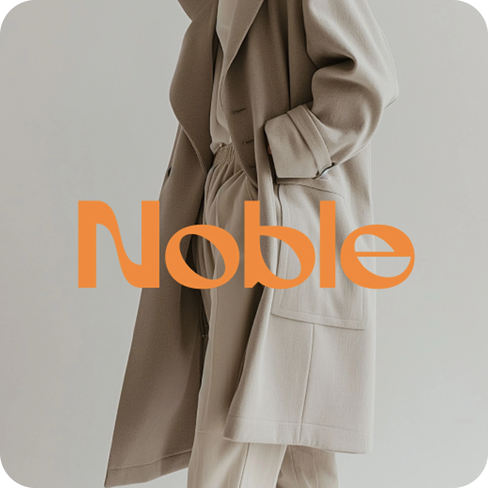 Person wearing a beige coat and cream pants with hand tucked in coat pocket.