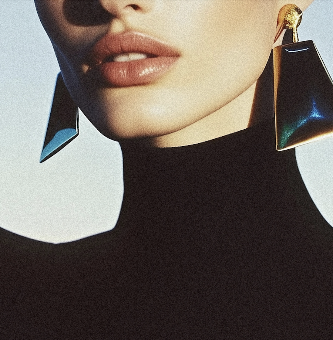 woman wearing large earrings and a black sweater