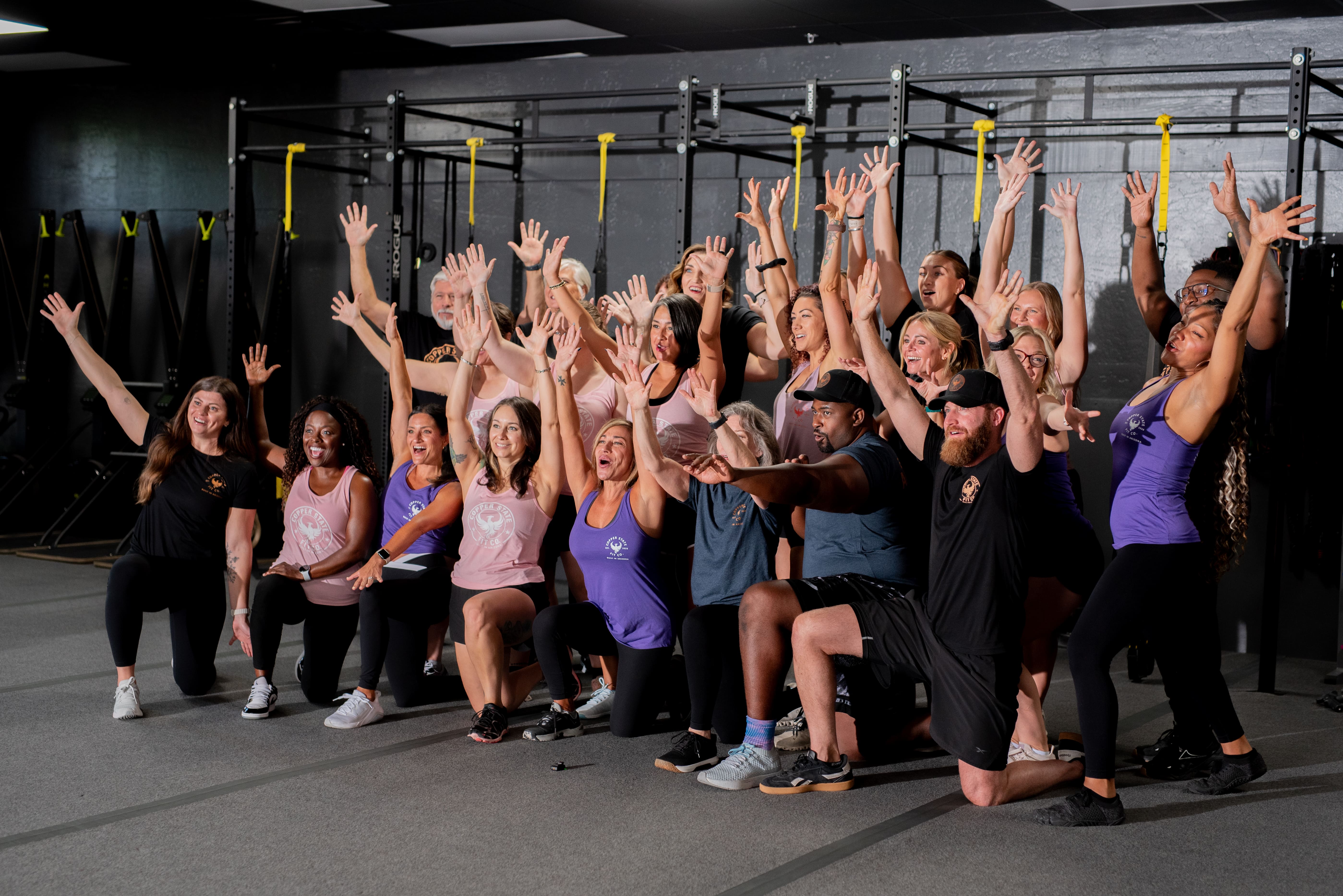 Team of Fit Body Boot Camp Arizona trainers smiling and ready to help members