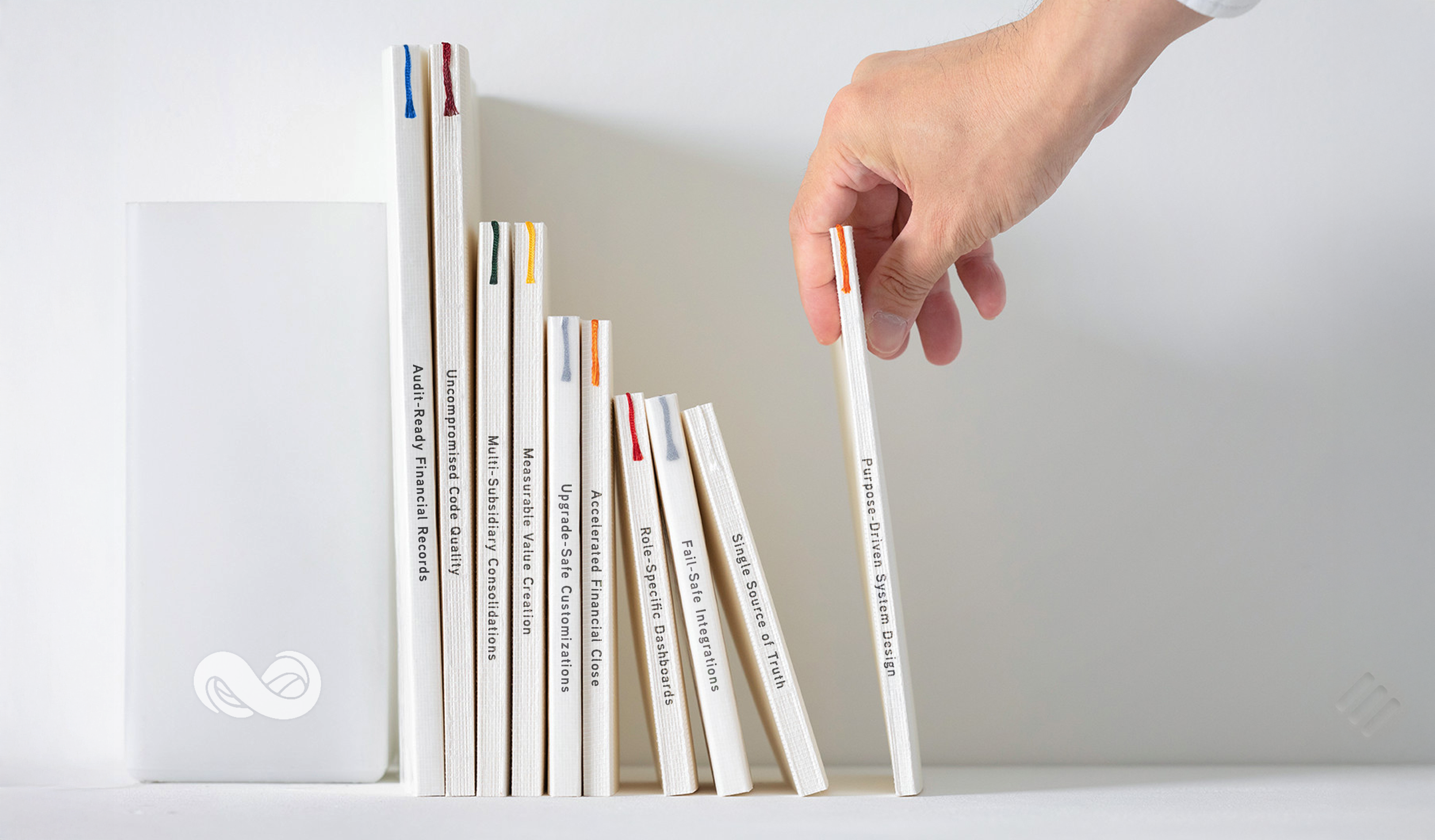 Hand picking up a white book titled Netsuite OneWorld from a row of Netsuite software books on a white shelf.