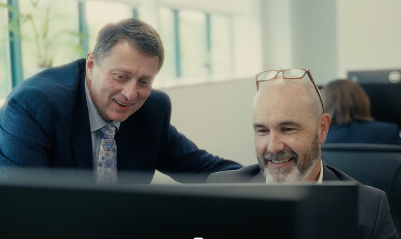 VistaFoods Employees Looking at a computer
