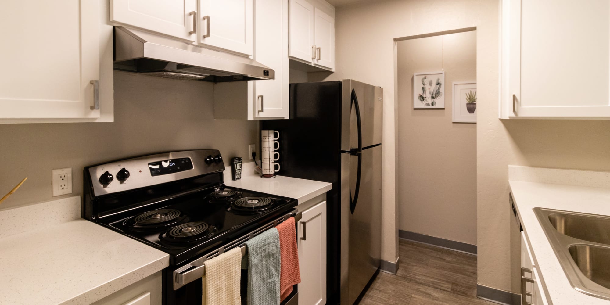 Kitchen with white cabinets and stainless steel appliances