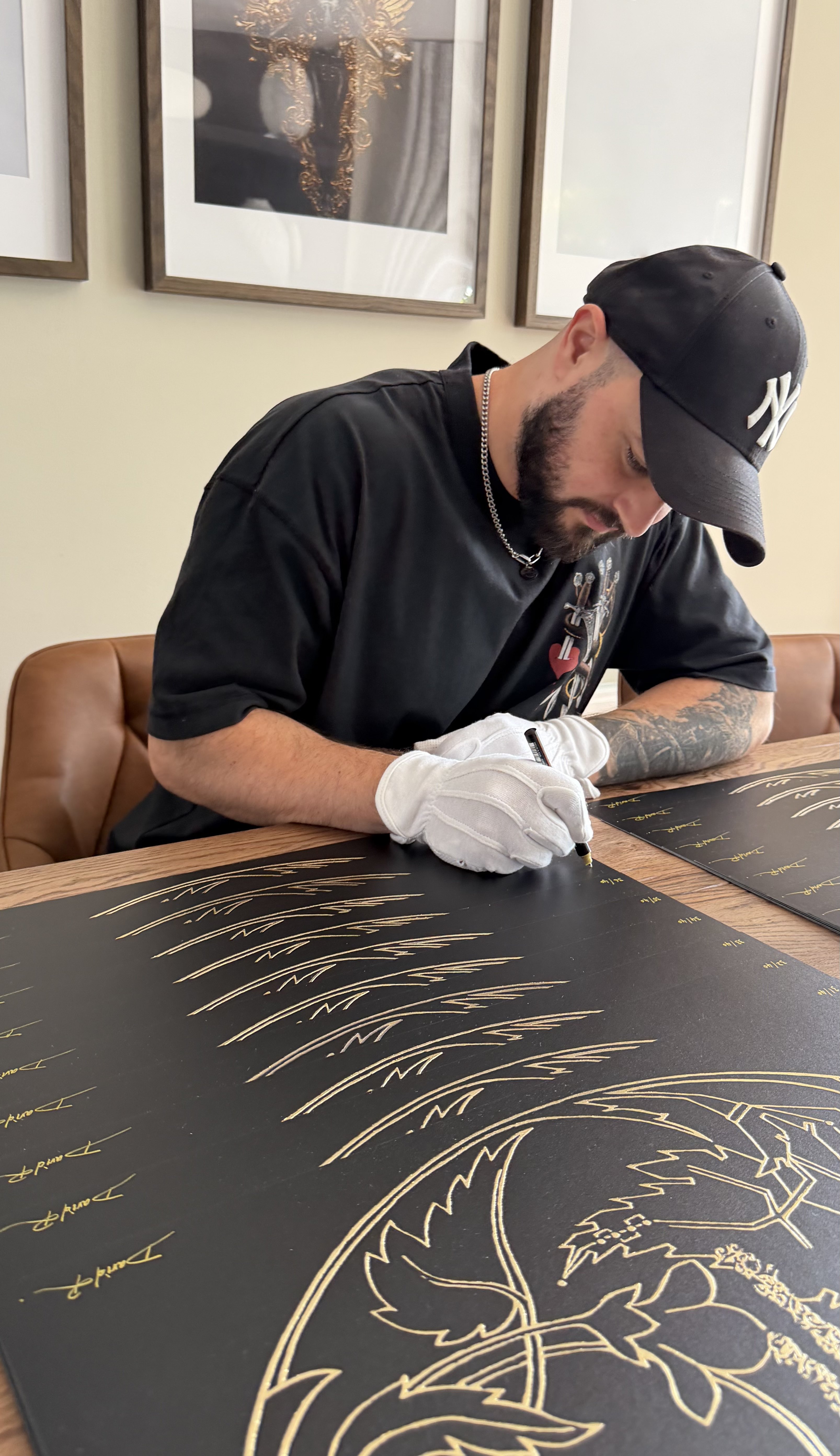 Artist David Roman signing The Alchemist limited edition prints