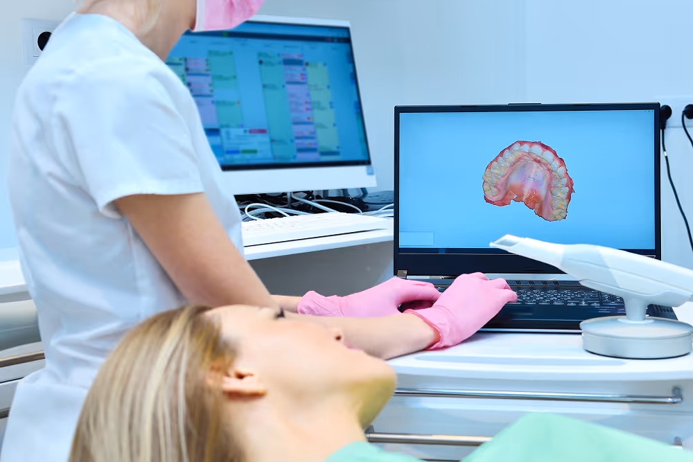 Surgeon reviewing a 3D implant treatment plan with a patient