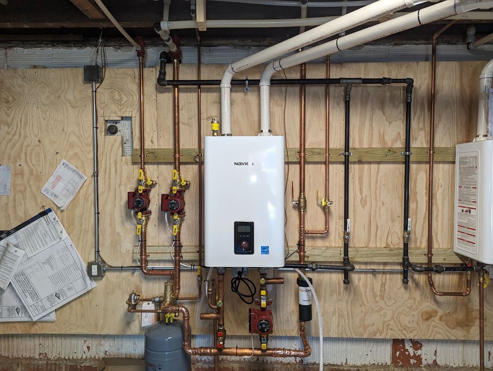 Basement repipe and tankless boiler conversion project in Silver Spring MD by Tim Whistler Plumbing
