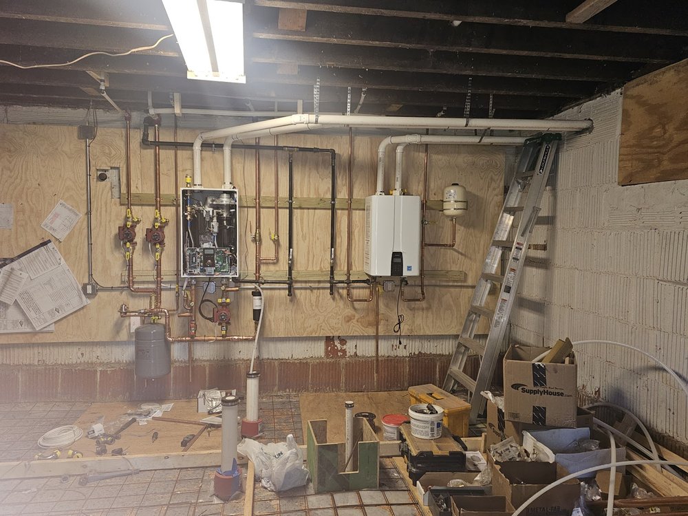 Basement repipe and tankless boiler conversion project in Silver Spring MD by Tim Whistler Plumbing