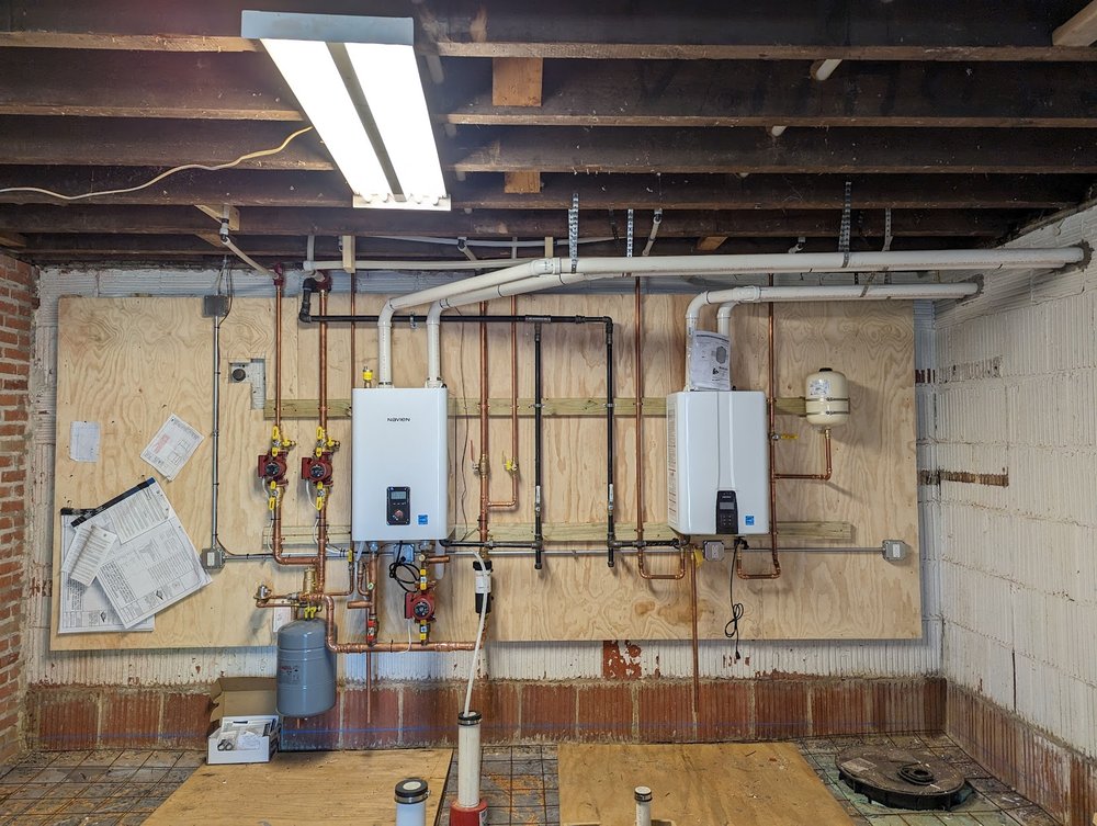 Basement repipe and tankless boiler conversion project in Silver Spring MD by Tim Whistler Plumbing