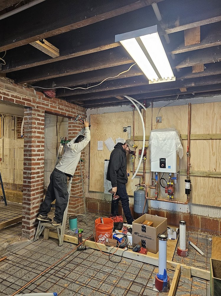 Basement repipe and tankless boiler conversion project in Silver Spring MD by Tim Whistler Plumbing
