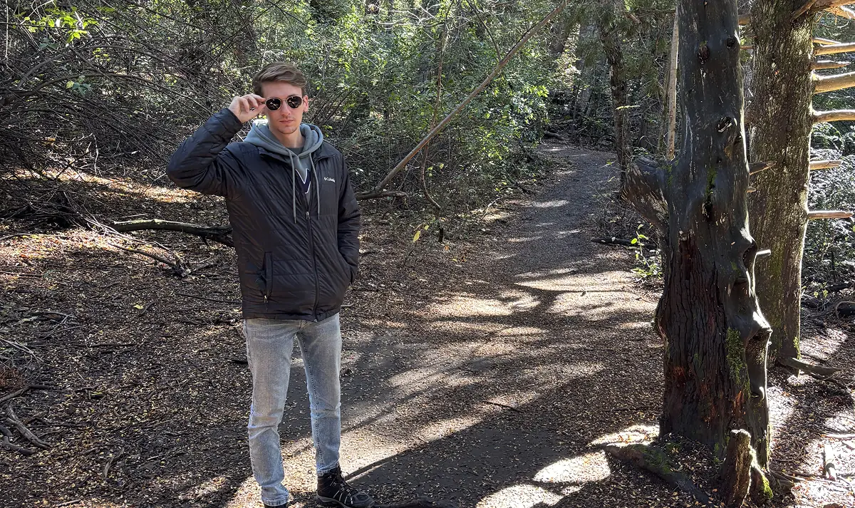 Picture of myself trekking in the woods.