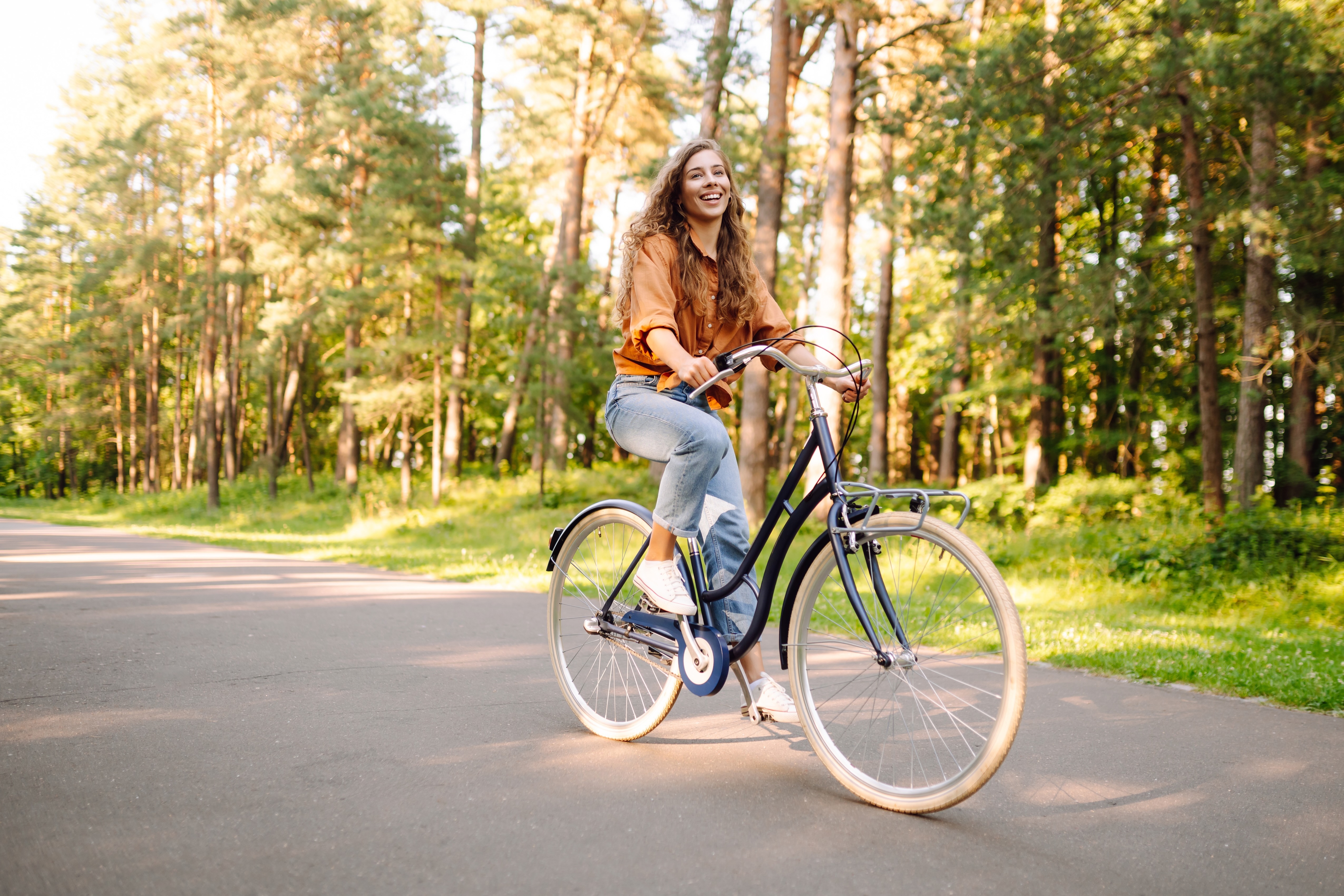 Woman riding bike stock photo