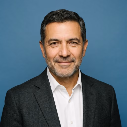 A headshot of Robert Delgado.
