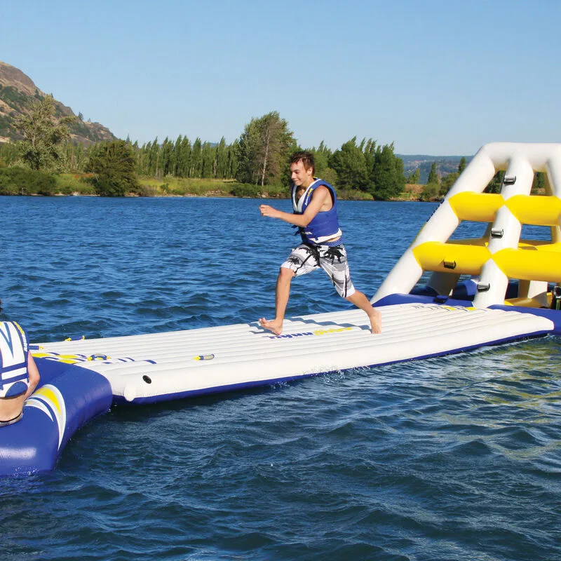 Rider running along an inflatable runway on a lake