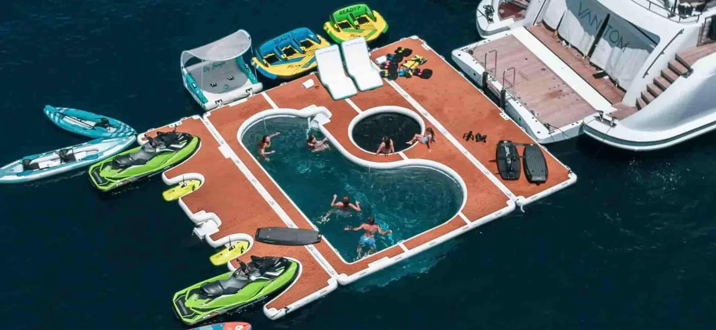 Aerial view of a YACHTBEACH Superior Pool and floating platforms off a yacht
