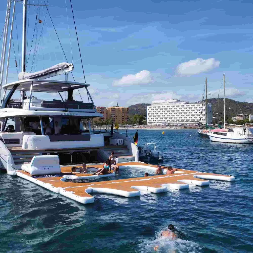 YACHTBEACH Premium Teak platform rigged beside a catamaran