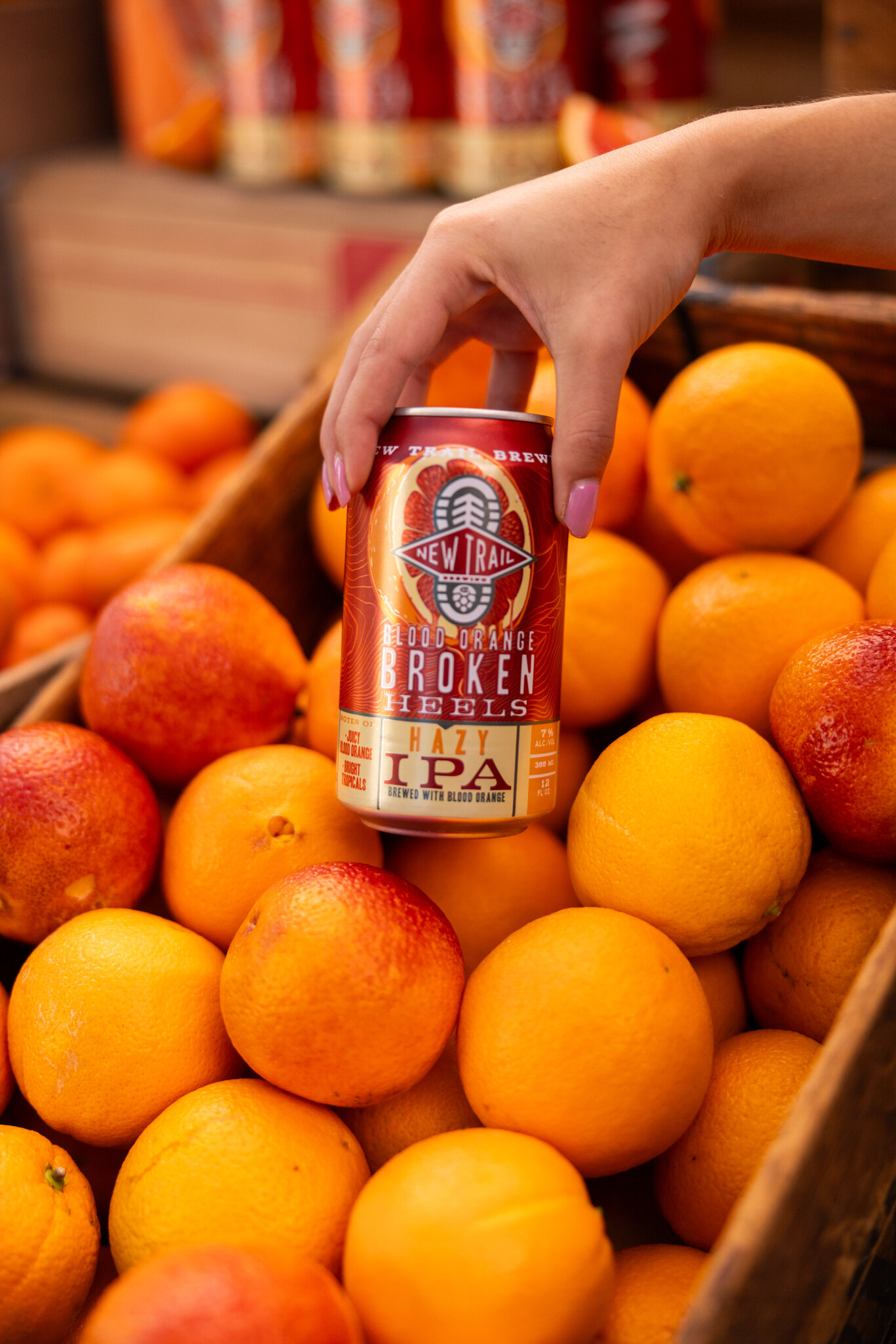 Picking a blood orange from the stand