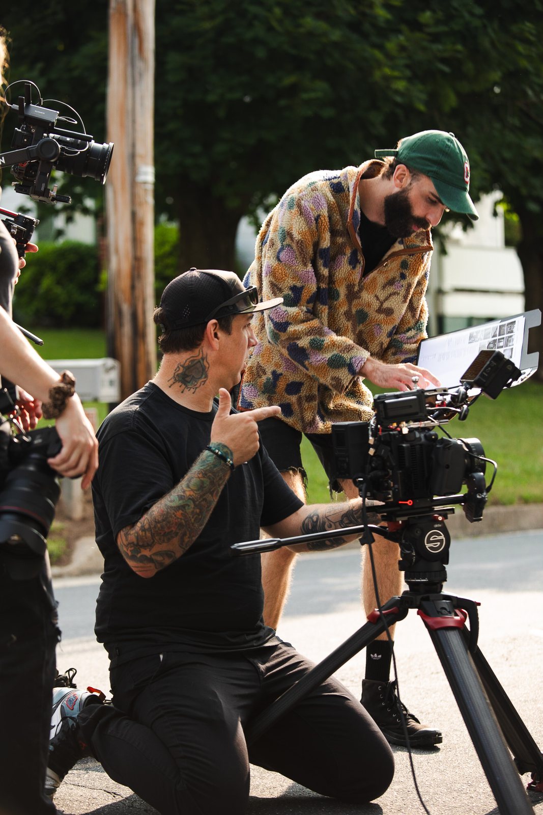 DMK crew checking the shot list on set