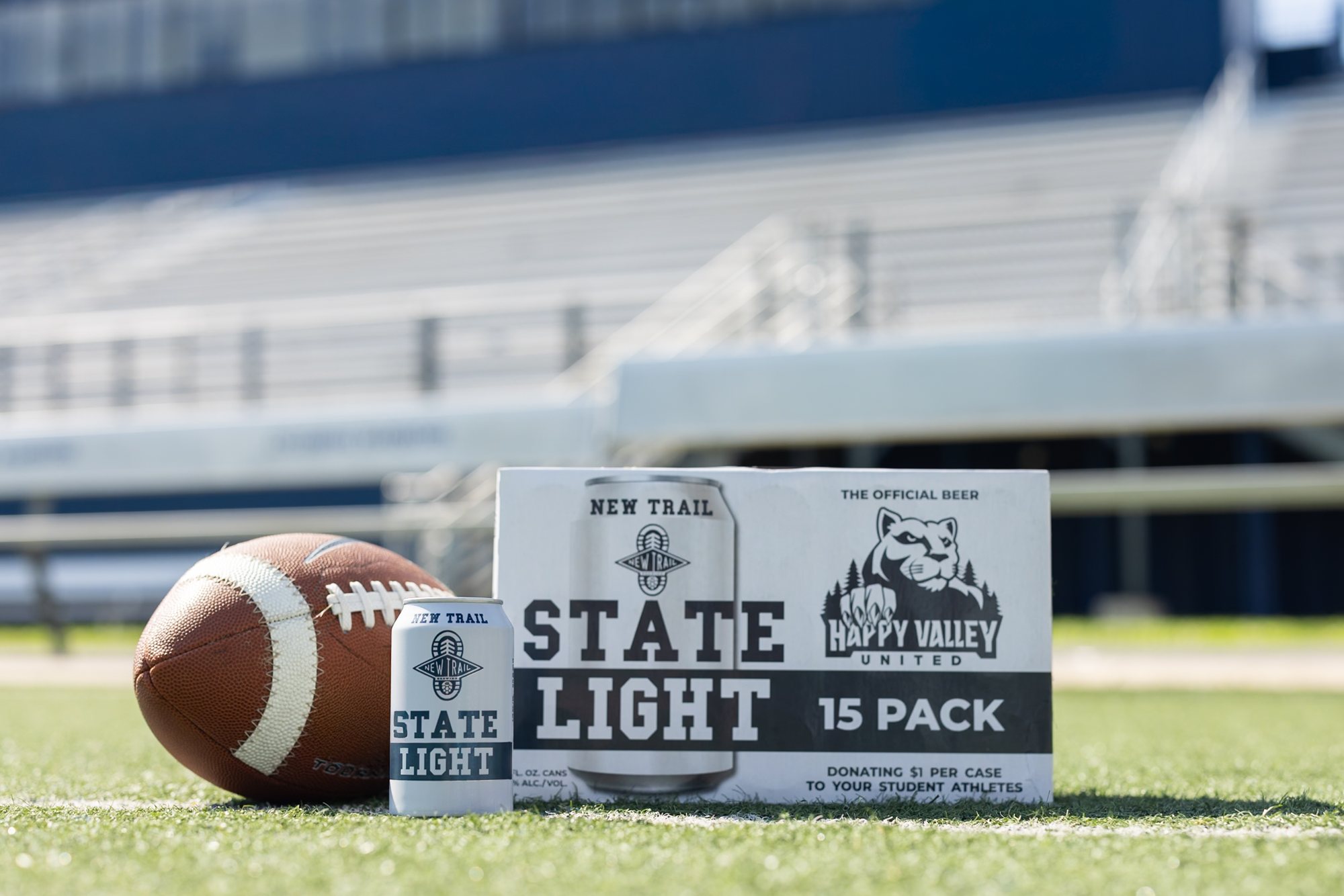 Football and State Light cans on the stadium field