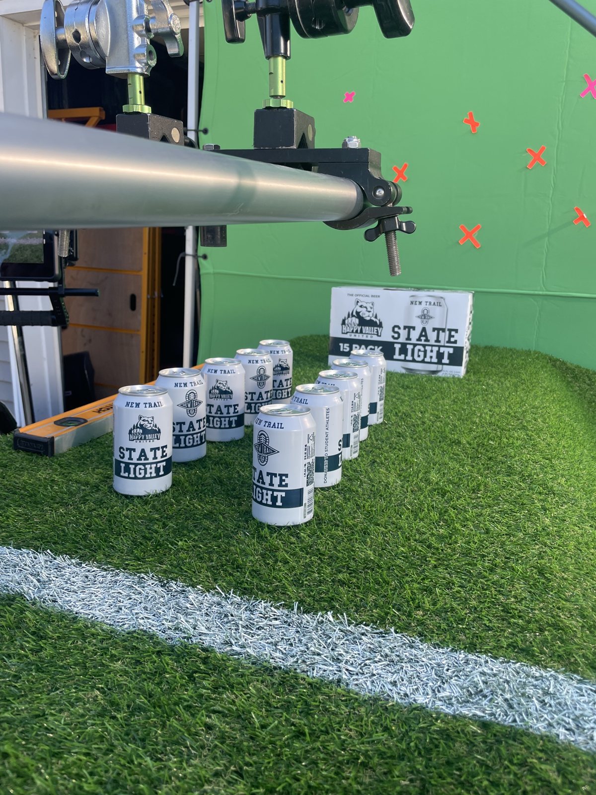 State Light cans on turf in front of a green screen, building the stadium shot