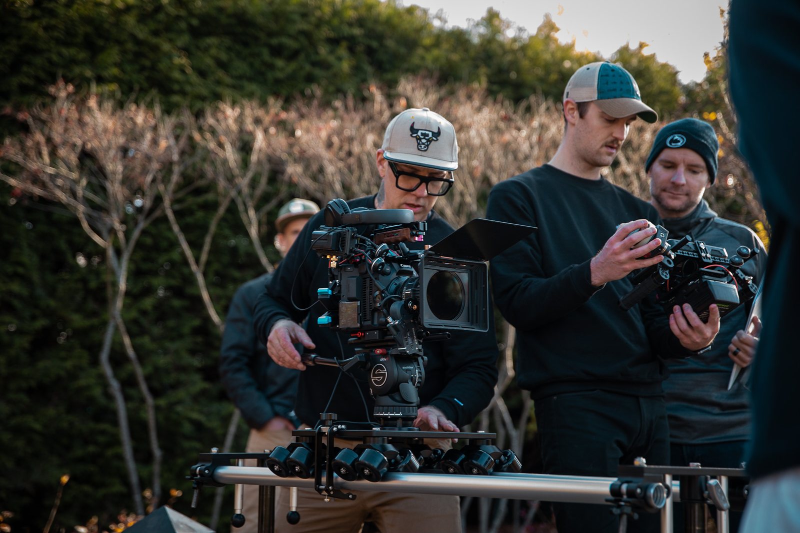 Crew framing a shot with the cinema camera rig in the Arboretum