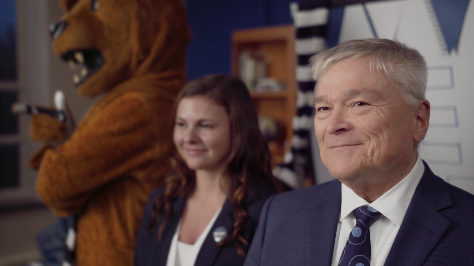 The Penn State President with the host and the Nittany Lion